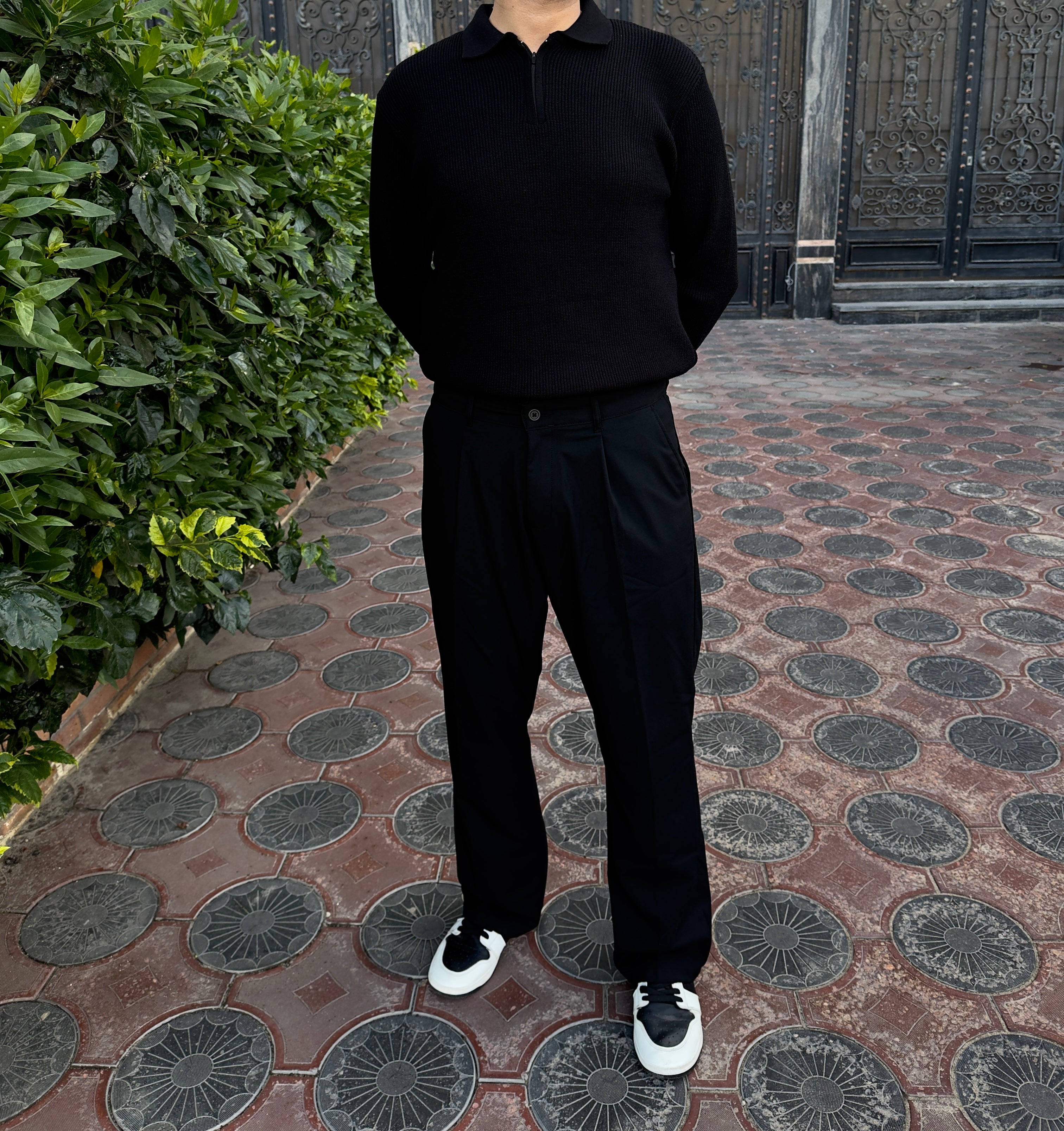 Black knitted quarter-zip polo