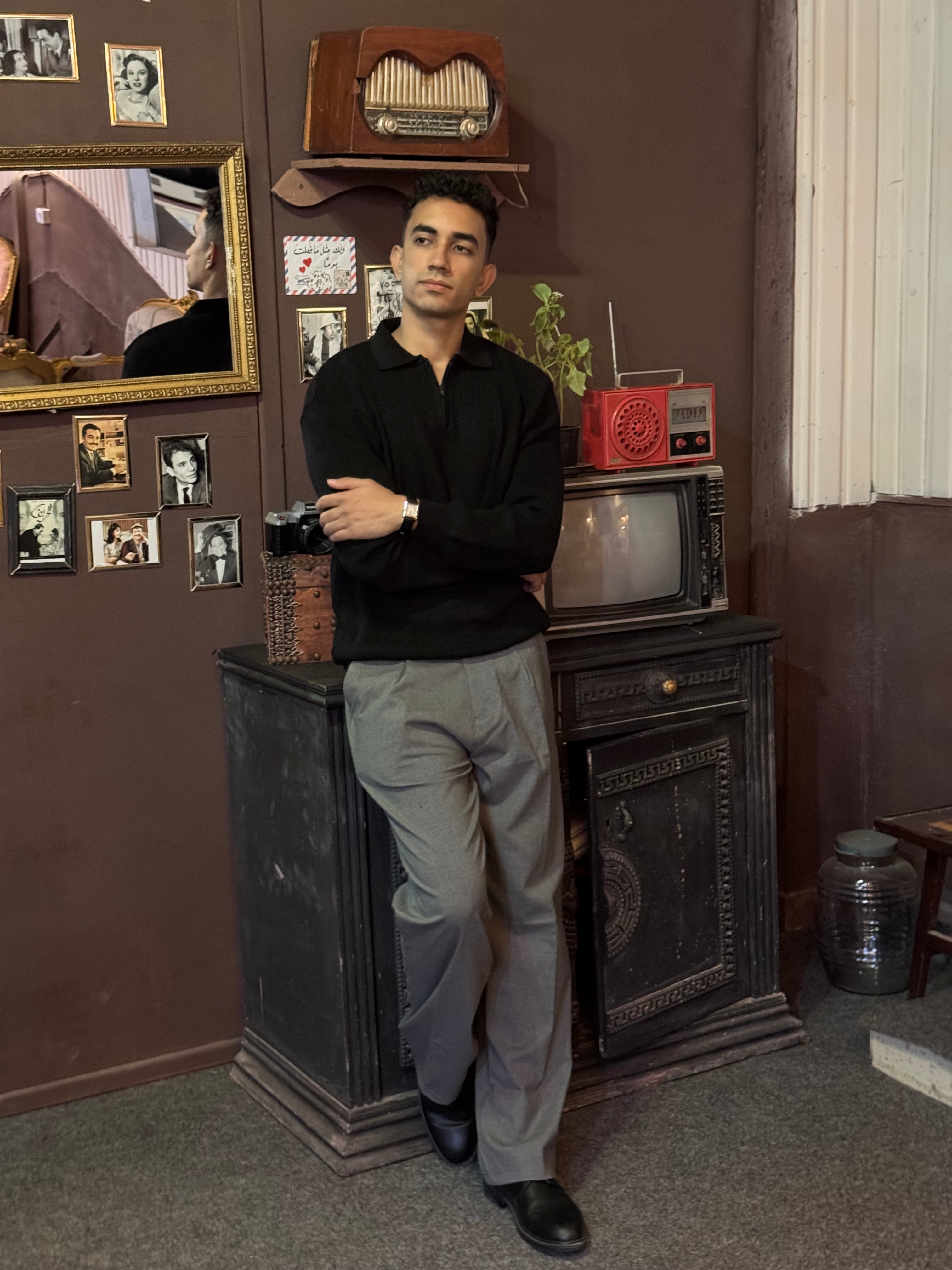 Black knitted quarter-zip polo