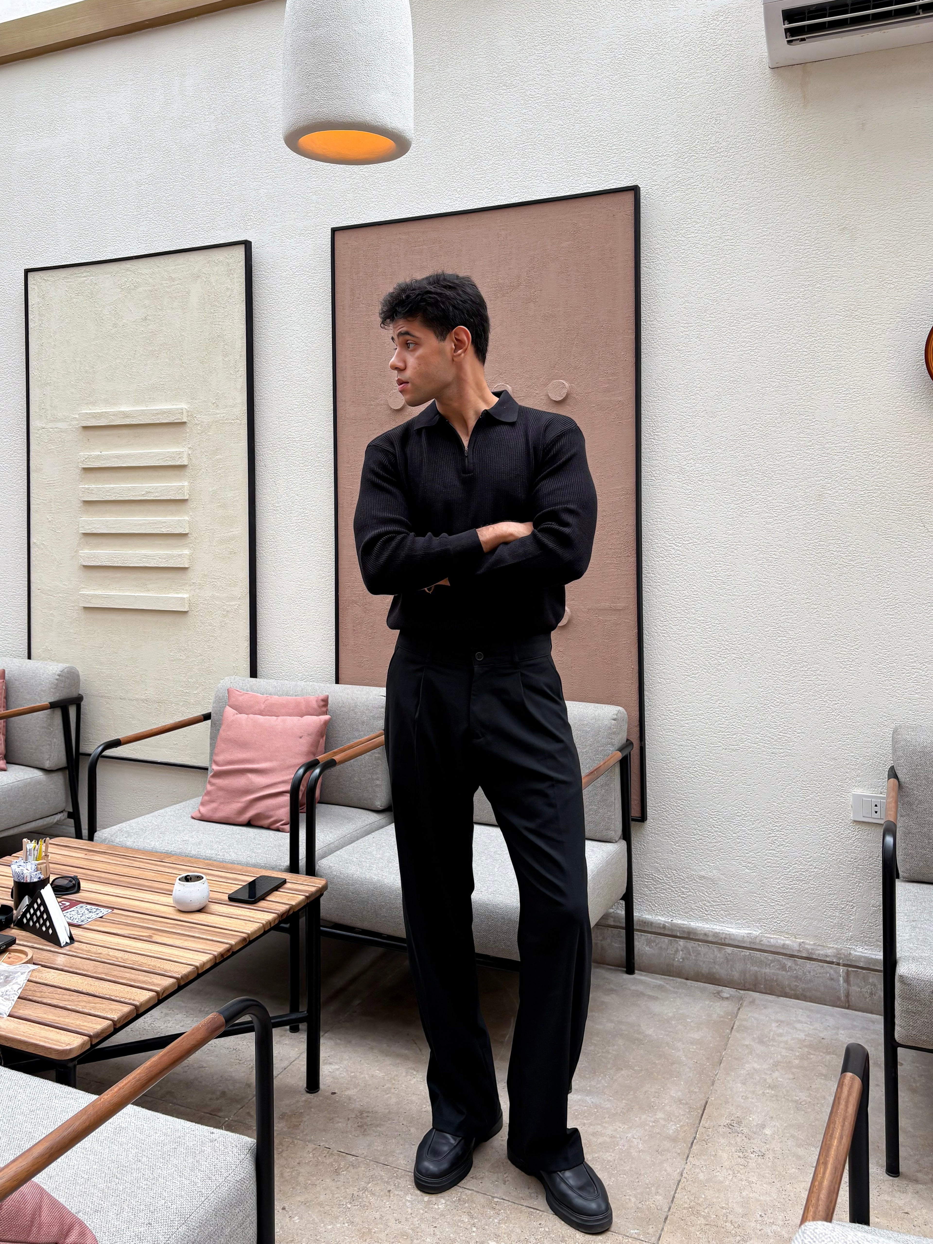 Black knitted quarter-zip polo