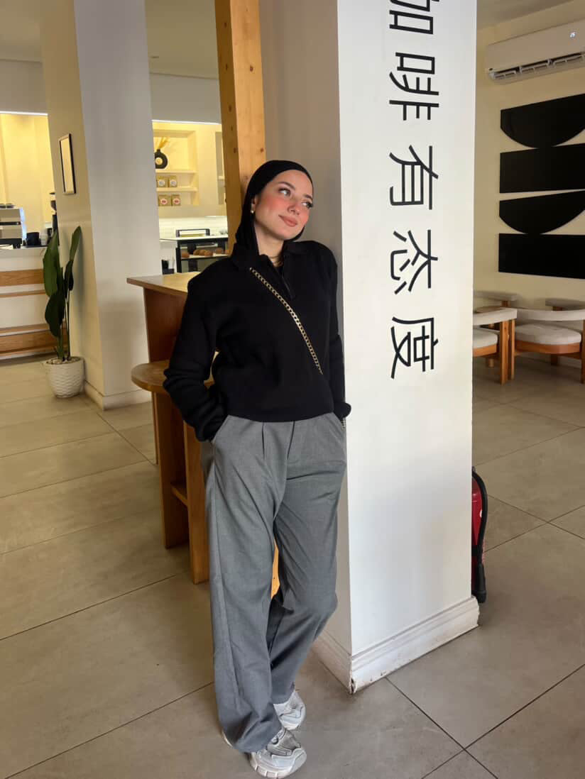 Black knitted quarter-zip polo