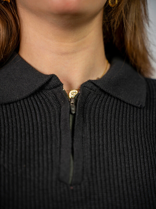Black knitted quarter-zip polo