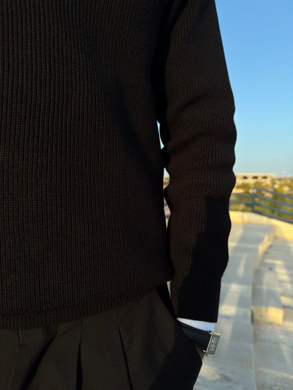 Black knitted quarter-zip polo