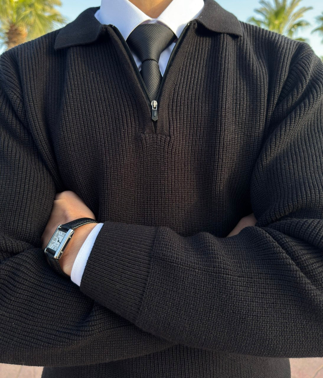 Black knitted quarter-zip polo